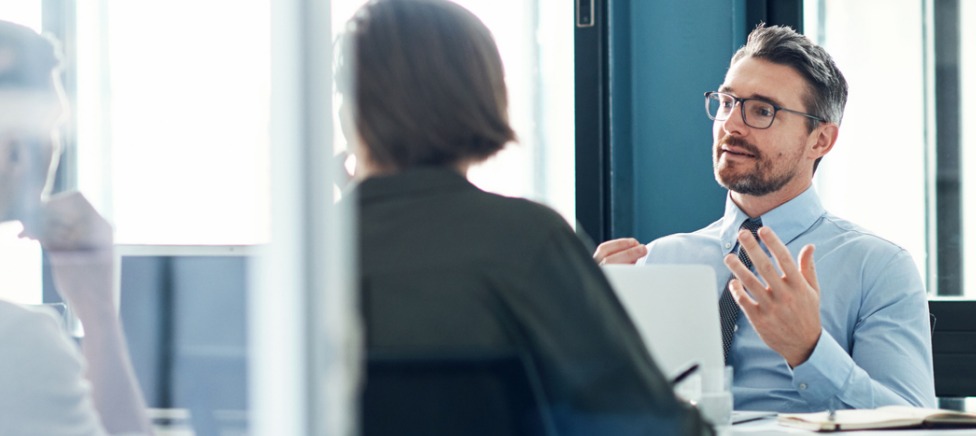 Mortgage Broker talking with clients